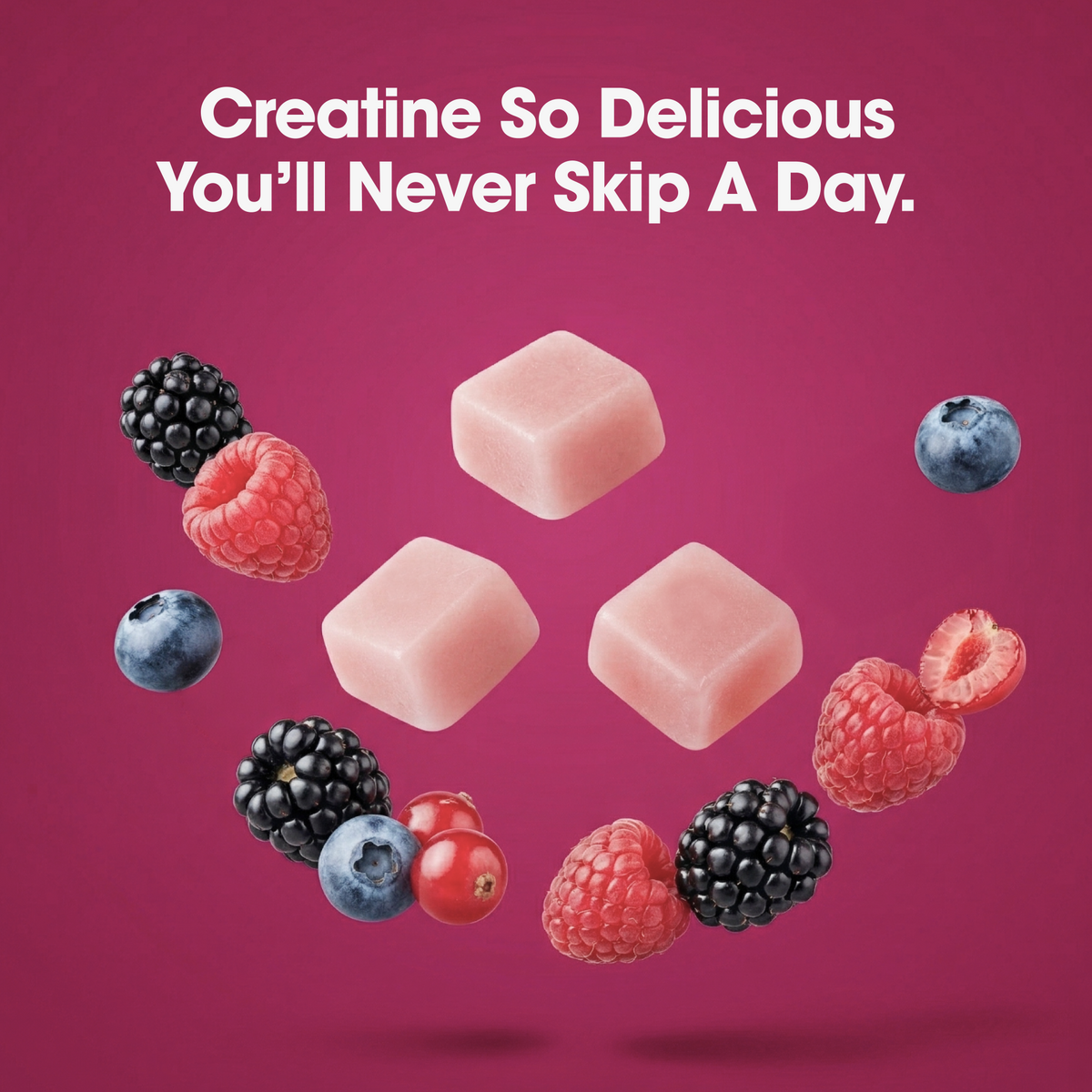 Three pale pink square candy pieces floating on a magenta background with white text reading 'Creatine So Delicious You'll Never Skip A Day.' Berries and a red berry are arranged around the candies.