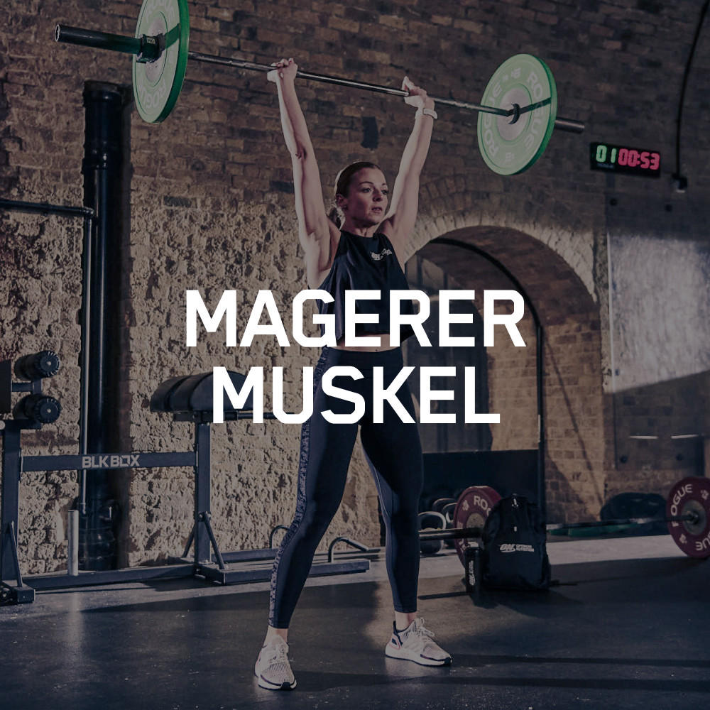 Weightlifter performing an overhead lift in a gym setting