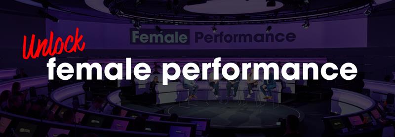 Panel discussion event with the theme "Unlock Female Performance" displayed on a large screen