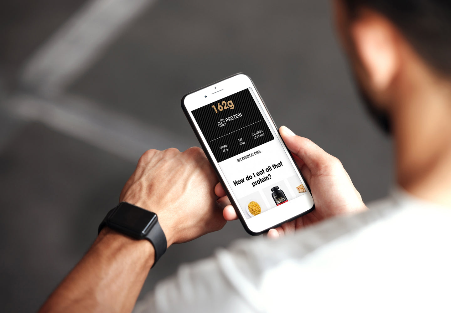 Man using smartphone to access a fitness app, displaying protein intake calculator and Optimum Nutrition products