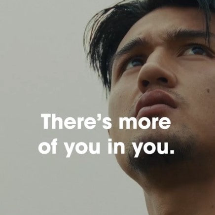 A person looking upwards with motivational text overlay: "There's more of you in you."