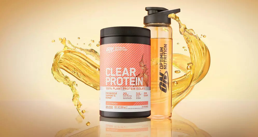 Optimum Nutrition Clear Protein tub and shaker with orange liquid splash, highlighting fruity protein drink option.