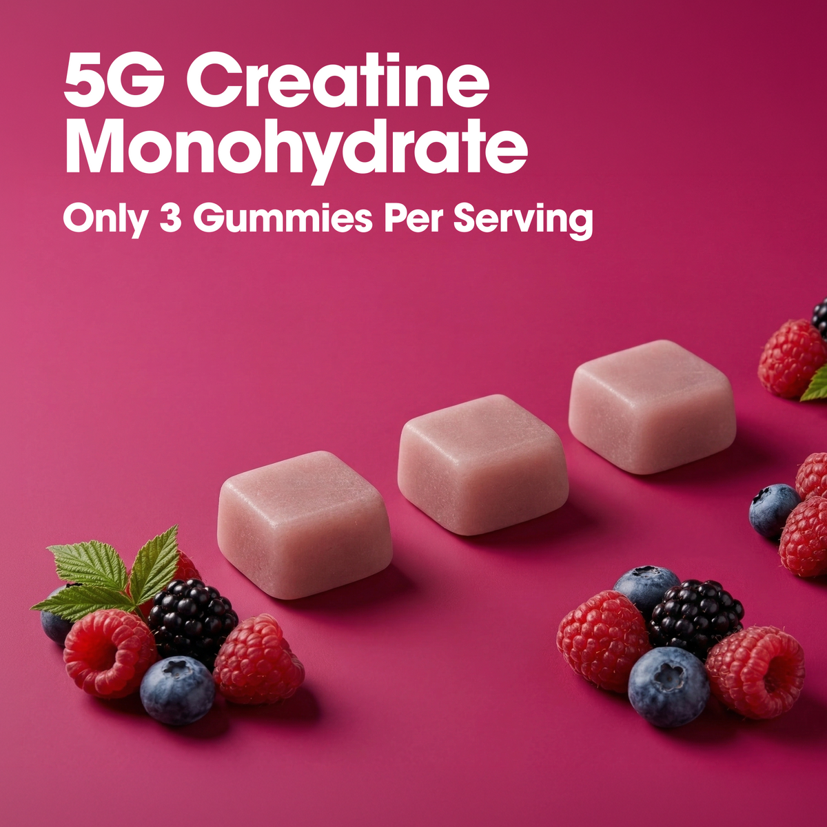Three pinkish-beige gummy candies arranged on a bright pink background with white text reading '5G Creatine Monohydrate' and 'Only 3 Gummies Per Serving,' plus berry and mint garnish.