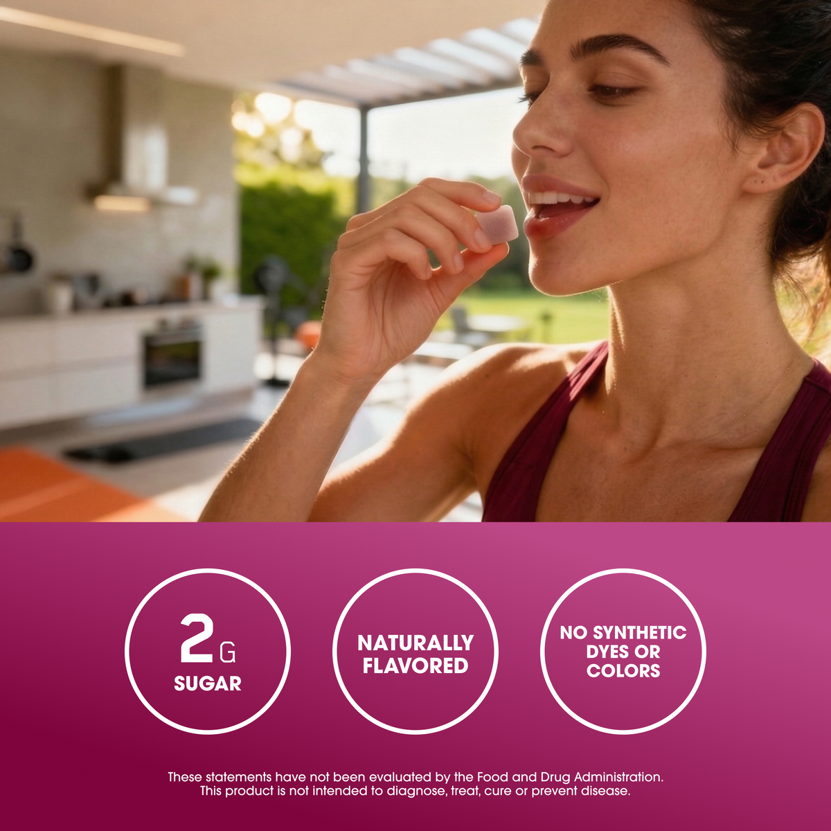A woman in a kitchen setting wearing a dark magenta tank top, with a purple banner at the bottom containing three white circles that read '2G SUGAR', 'NATURALLY FLAVORED', and 'NO SYNTHETIC DYES OR COLORS'.