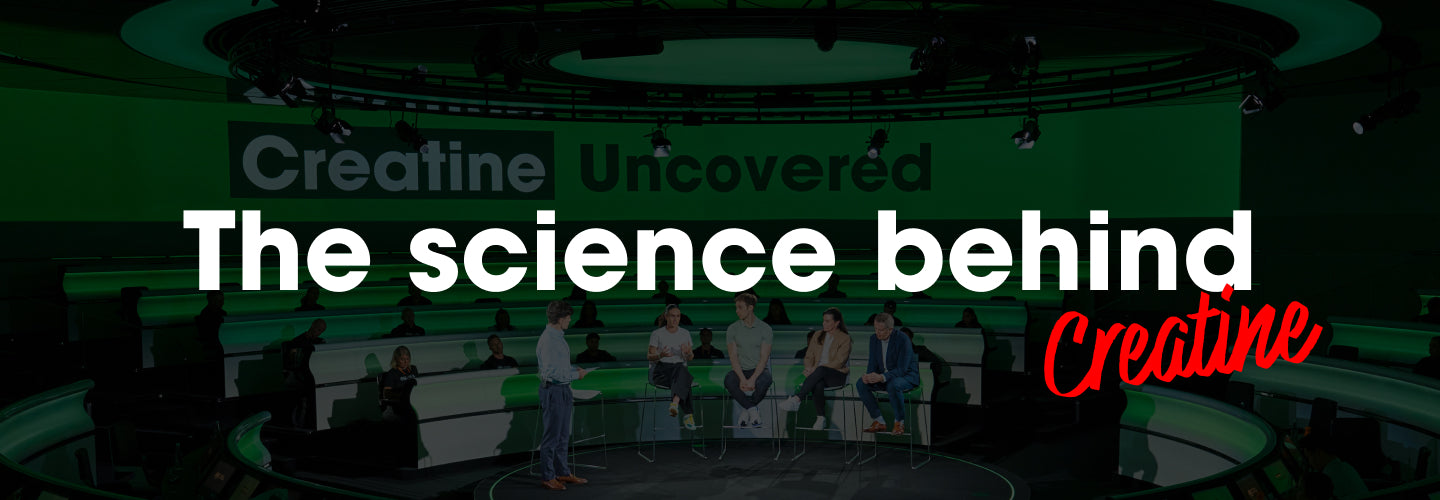 Panel discussion on creatine science with experts on stage, focusing on creatine's role in fitness and nutrition