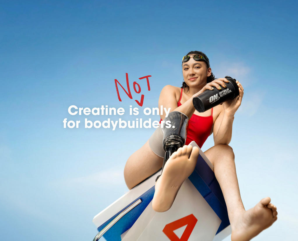 Athlete holding an Optimum Nutrition shaker bottle, promoting the use of creatine for all fitness enthusiasts