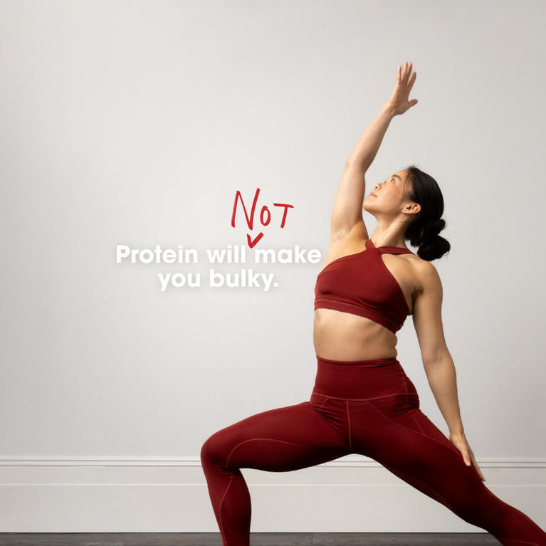 A woman in athletic wear performing a yoga pose, emphasizing fitness and flexibility