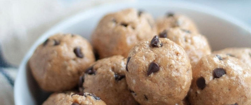 Bowl of protein energy bites with chocolate chips, suitable for post-workout nutrition and high-intensity workouts