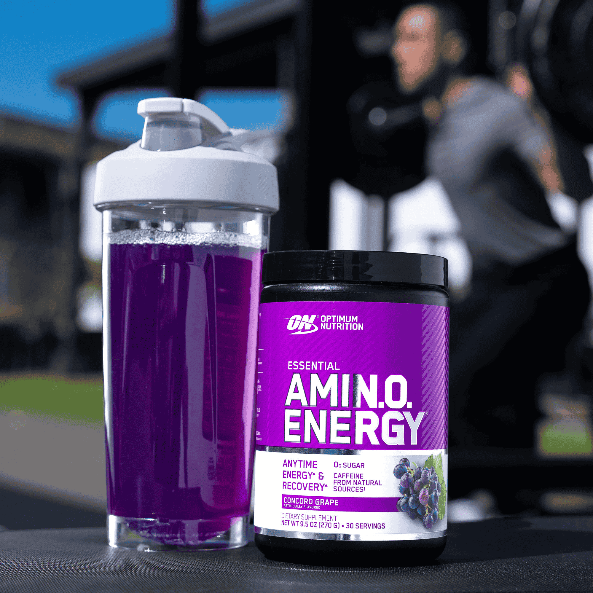 Optimum Nutrition Essential Amino Energy, Concord Grape flavor, 30 servings container, next to a shaker bottle
