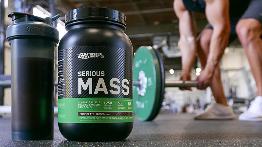 Optimum Nutrition Serious Mass protein powder container with shaker bottle, used for muscle gain and weight gain goals