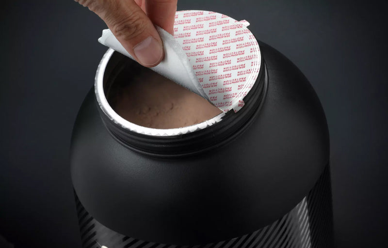 Optimum Nutrition Gold Standard 100% Whey Protein container being opened, suitable for post-workout nutrition
