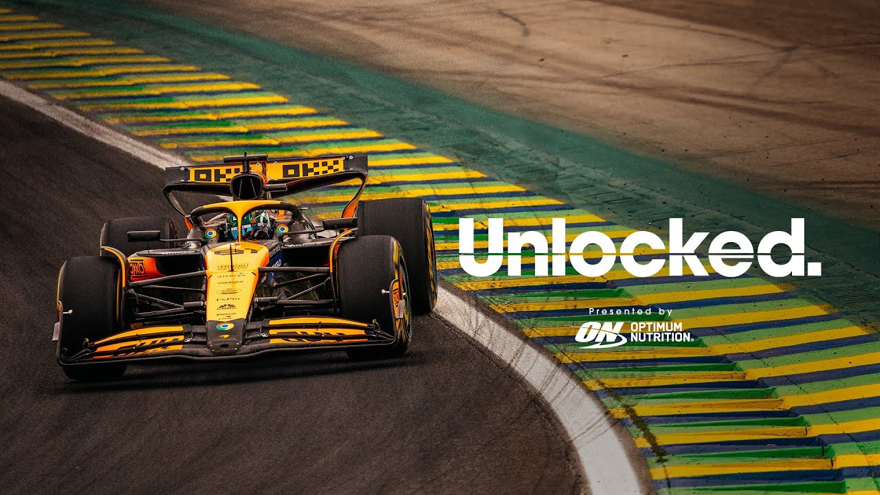 Formula 1 car on a racetrack, with "Unlocked" text and Optimum Nutrition logo
