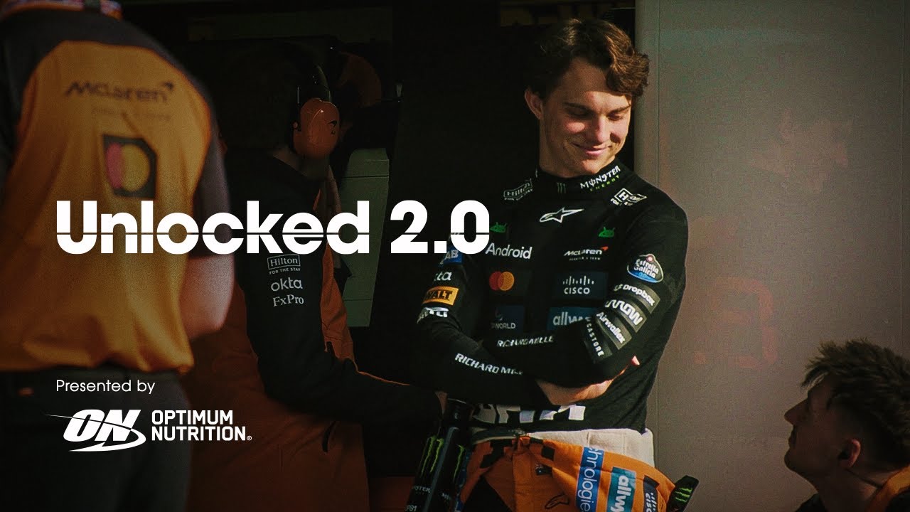 Optimum Nutrition logo with a racing-themed backdrop, featuring a person in a racing suit